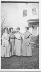 SA0058 - Alice Smith was from the Church Family. The Shaker sisters are shown outside in front of an unidentified building. Someone named Anna is also in the photograph.